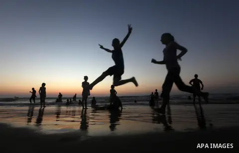 Palestinian children play at the beach during the last Friday holiday before the beginning of new school year in Gaza city, Aug 31, 2012. Next Sunday is the First day for the new school year according to Palestinian Mini...