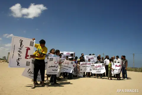 Palestinian children attend a protest calling for justice for Rachel Corrie in Rafah, Gaza Strip, Sep. 01, 2012. An Israeli court ruled that Israel did not intentionally kill pro-Palestinian activist Rachel Corrie, run o...