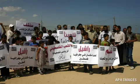Palestinian children attend a protest calling for justice for Rachel Corrie in Rafah, Gaza Strip, Sep. 01, 2012. An Israeli court ruled that Israel did not intentionally kill pro-Palestinian activist Rachel Corrie, run o...