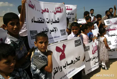 Palestinian children attend a protest calling for justice for Rachel Corrie in Rafah, Gaza Strip, Sep. 01, 2012. An Israeli court ruled that Israel did not intentionally kill pro-Palestinian activist Rachel Corrie, run o...