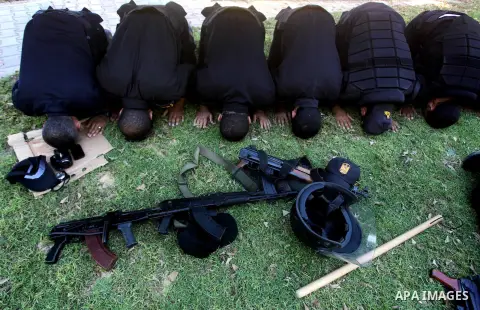 Members of Hamas security forces pray as others patrol in a street in Gaza city September 1, 2012. Photo by Ashraf Amra