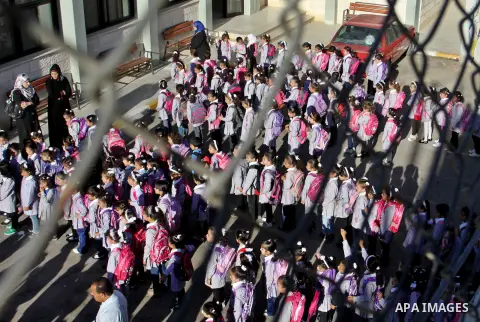 Palestinian students return back to their schools in the morning of the first day of the new year study in the West Bnak city of Nablus on Sep. 02, 2012. The academic year began in the Gaza Strip and West Bank on Sept. 0...