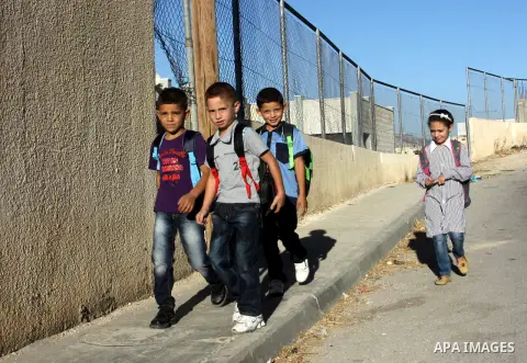 Palestinian students return back to their schools in the morning of the first day of the new year study in the West Bnak city of Nablus on Sep. 02, 2012. The academic year began in the Gaza Strip and West Bank on Sept. 0...
