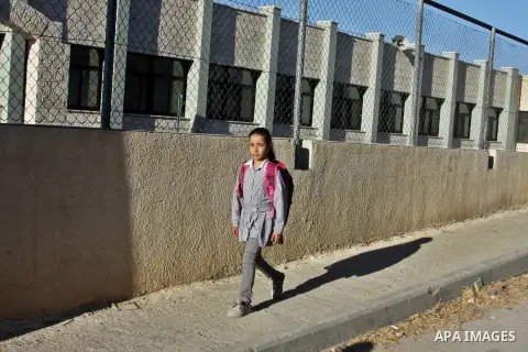 Palestinian students return back to their schools in the morning of the first day of the new year study in the West Bnak city of Nablus on Sep. 02, 2012. The academic year began in the Gaza Strip and West Bank on Sept. 0...