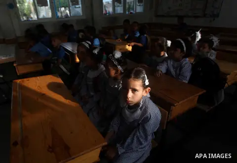 Palestinian students return back to their schools "UNRWA" in the morning of the first day of the new year study in Gaza city on Sep. 02, 2012. The academic year began in the Gaza Strip and West Bank on Sept. 02. Photo by...