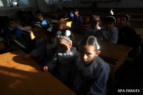 Palestinian students return back to their schools "UNRWA" in the morning of the first day of the new year study in Gaza city on Sep. 02, 2012. The academic year began in the Gaza Strip and West Bank on Sept. 02. Photo by...