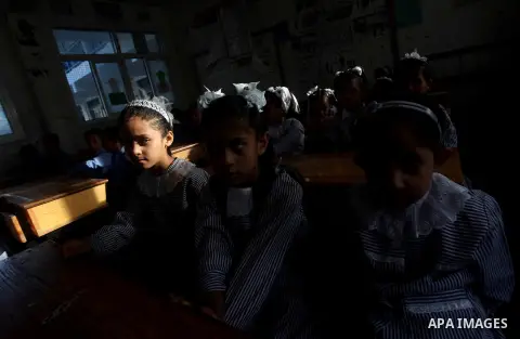 Palestinian students return back to their schools "UNRWA" in the morning of the first day of the new year study in Gaza city on Sep. 02, 2012. The academic year began in the Gaza Strip and West Bank on Sept. 02. Photo by...