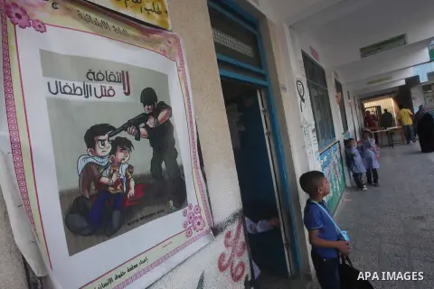 Palestinian students return back to their schools "UNRWA" in the morning of the first day of the new year study in Gaza city on Sep. 02, 2012. The academic year began in the Gaza Strip and West Bank on Sept. 02. Photo by...