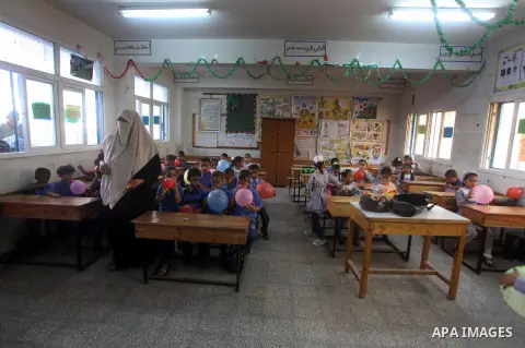Palestinian students return back to their schools "UNRWA" in the morning of the first day of the new year study in Gaza city on Sep. 02, 2012. The academic year began in the Gaza Strip and West Bank on Sept. 02. Photo by...