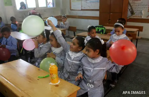 Palestinian students return back to their schools "UNRWA" in the morning of the first day of the new year study in Gaza city on Sep. 02, 2012. The academic year began in the Gaza Strip and West Bank on Sept. 02. Photo by...