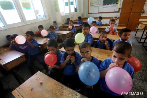 Palestinian students return back to their schools "UNRWA" in the morning of the first day of the new year study in Gaza city on Sep. 02, 2012. The academic year began in the Gaza Strip and West Bank on Sept. 02. Photo by...
