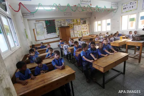 Palestinian students return back to their schools "UNRWA" in the morning of the first day of the new year study in Gaza city on Sep. 02, 2012. The academic year began in the Gaza Strip and West Bank on Sept. 02. Photo by...