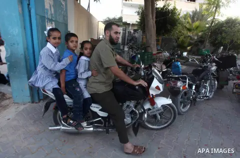 Palestinian students return back to their schools "UNRWA" in the morning of the first day of the new year study in Gaza city on Sep. 02, 2012. The academic year began in the Gaza Strip and West Bank on Sept. 02. Photo by...