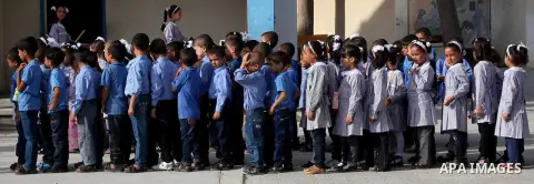 Palestinian students return back to their schools "UNRWA" in the morning of the first day of the new year study in Gaza city on Sep. 02, 2012. The academic year began in the Gaza Strip and West Bank on Sept. 02. Photo by...