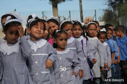 Palestinian students return back to their schools "UNRWA" in the morning of the first day of the new year study in Gaza city on Sep. 02, 2012. The academic year began in the Gaza Strip and West Bank on Sept. 02. Photo by...