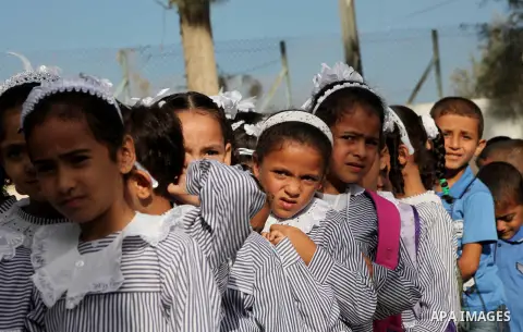 Palestinian students return back to their schools "UNRWA" in the morning of the first day of the new year study in Gaza city on Sep. 02, 2012. The academic year began in the Gaza Strip and West Bank on Sept. 02. Photo by...