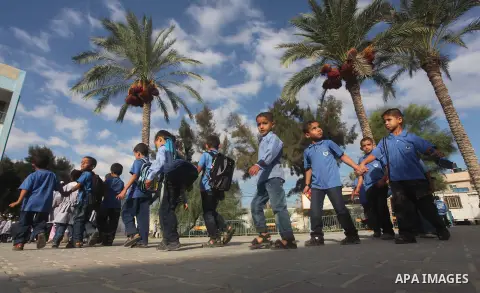Palestinian students return back to their schools "UNRWA" in the morning of the first day of the new year study in Gaza city on Sep. 02, 2012. The academic year began in the Gaza Strip and West Bank on Sept. 02. Photo by...