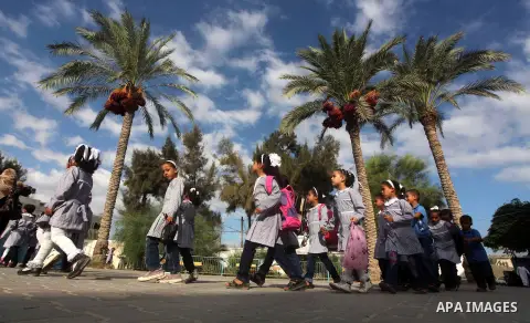 Palestinian students return back to their schools "UNRWA" in the morning of the first day of the new year study in Gaza city on Sep. 02, 2012. The academic year began in the Gaza Strip and West Bank on Sept. 02. Photo by...