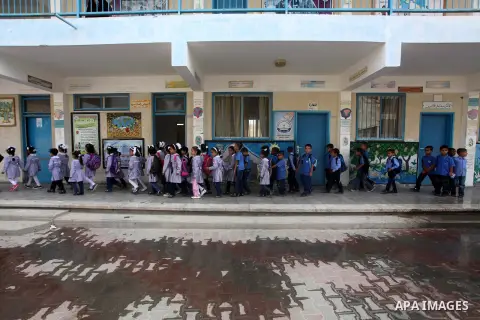 Palestinian students return back to their schools "UNRWA" in the morning of the first day of the new year study in Gaza city on Sep. 02, 2012. The academic year began in the Gaza Strip and West Bank on Sept. 02. Photo by...
