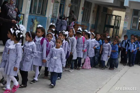 Palestinian students return back to their schools "UNRWA" in the morning of the first day of the new year study in Gaza city on Sep. 02, 2012. The academic year began in the Gaza Strip and West Bank on Sept. 02. Photo by...