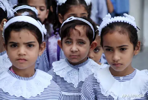 Palestinian students return back to their schools "UNRWA" in the morning of the first day of the new year study in Gaza city on Sep. 02, 2012. The academic year began in the Gaza Strip and West Bank on Sept. 02. Photo by...