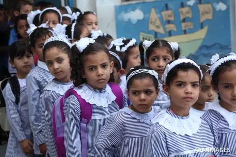Palestinian students return back to their schools "UNRWA" in the morning of the first day of the new year study in Gaza city on Sep. 02, 2012. The academic year began in the Gaza Strip and West Bank on Sept. 02. Photo by...