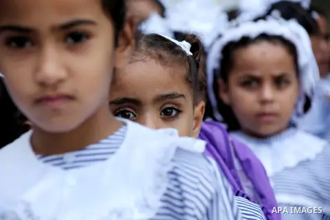 Palestinian students return back to their schools "UNRWA" in the morning of the first day of the new year study in Gaza city on Sep. 02, 2012. The academic year began in the Gaza Strip and West Bank on Sept. 02. Photo by...