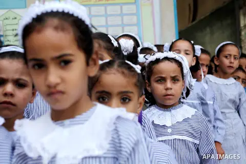 Palestinian students return back to their schools "UNRWA" in the morning of the first day of the new year study in Gaza city on Sep. 02, 2012. The academic year began in the Gaza Strip and West Bank on Sept. 02. Photo by...