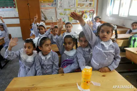 Palestinian students return back to their schools "UNRWA" in the morning of the first day of the new year study in Gaza city on Sep. 02, 2012. The academic year began in the Gaza Strip and West Bank on Sept. 02. Photo by...