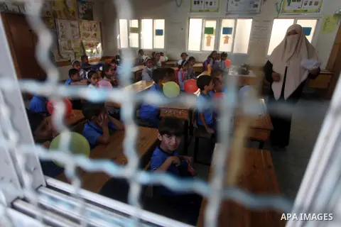 Palestinian students return back to their schools "UNRWA" in the morning of the first day of the new year study in Gaza city on Sep. 02, 2012. The academic year began in the Gaza Strip and West Bank on Sept. 02. Photo by...
