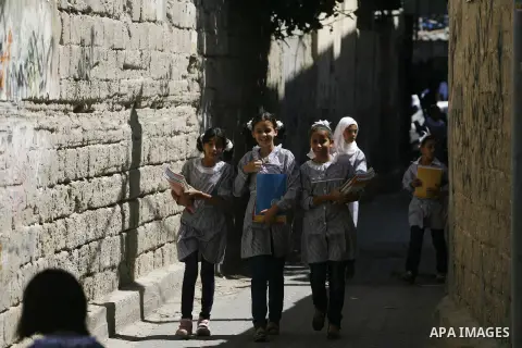 Palestinian students return back to their schools in the morning of the first day of the new year study in Rafah in the southern Gaza Strip. 02, 2012. The academic year began in the Gaza Strip and West Bank on Sept. 02....