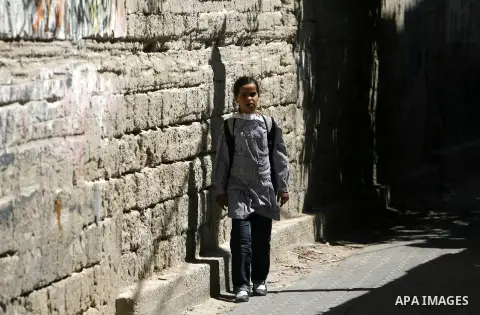 Palestinian students return back to their schools in the morning of the first day of the new year study in Rafah in the southern Gaza Strip. 02, 2012. The academic year began in the Gaza Strip and West Bank on Sept. 02....