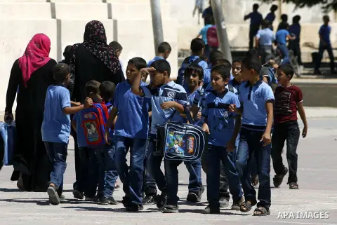 Palestinian students return back to their schools in the morning of the first day of the new year study in Rafah in the southern Gaza Strip. 02, 2012. The academic year began in the Gaza Strip and West Bank on Sept. 02....