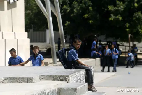 Palestinian students return back to their schools in the morning of the first day of the new year study in Rafah in the southern Gaza Strip. 02, 2012. The academic year began in the Gaza Strip and West Bank on Sept. 02....