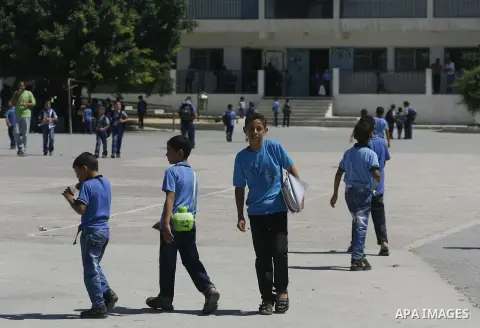 Palestinian students return back to their schools in the morning of the first day of the new year study in Rafah in the southern Gaza Strip. 02, 2012. The academic year began in the Gaza Strip and West Bank on Sept. 02....