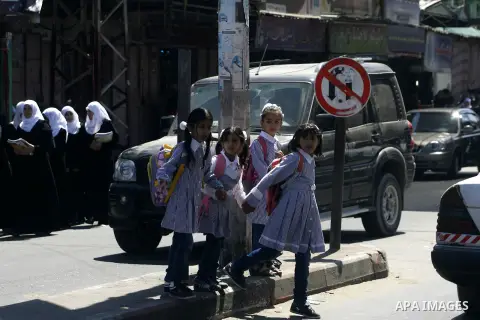 Palestinian students return back to their schools in the morning of the first day of the new year study in Rafah in the southern Gaza Strip. 02, 2012. The academic year began in the Gaza Strip and West Bank on Sept. 02....