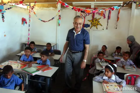 Palestinian Prime Minister Salam Fayyad visits the school "al-Khan al-Ahmar", on the first day of the new school year, in Abu Hindi valley in the bedouin, in occupied West Bank near Jericho, on September 2, 2012. Photo b...