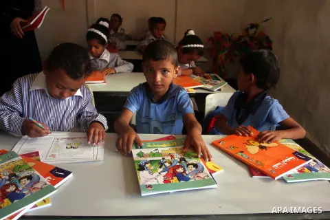 Palestinian students at their school during the visit of Palestinian Prime Minister Salam Fayyad to the "al-Khan al-Ahmar" school, on the first day of the new school year, in Abu Hindi valley in the bedouin, in occupied...