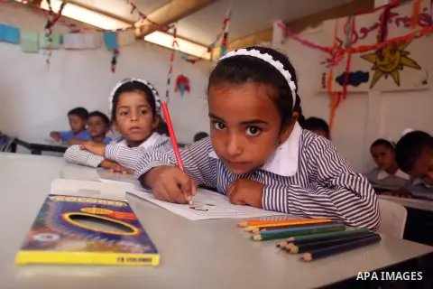 Palestinian students at their school during the visit of Palestinian Prime Minister Salam Fayyad to the "al-Khan al-Ahmar" school, on the first day of the new school year, in Abu Hindi valley in the bedouin, in occupied...