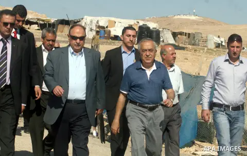 Palestinian Prime Minister Salam Fayyad visits the school "al-Khan al-Ahmar", on the first day of the new school year, in Abu Hindi valley in the bedouin, in occupied West Bank near Jericho, on September 2, 2012. Photo b...