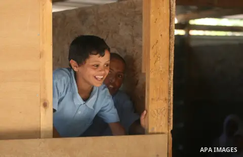 Palestinian students at their school during the visit of Palestinian Prime Minister Salam Fayyad to the "al-Khan al-Ahmar" school, on the first day of the new school year, in Abu Hindi valley in the bedouin, in occupied...