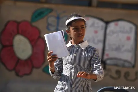 A Palestinian student walks at her school during the visit of Palestinian Prime Minister Salam Fayyad to the "al-Khan al-Ahmar" school, on the first day of the new school year, in Abu Hindi valley in the bedouin, in occu...