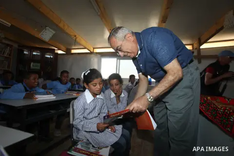 Palestinian Prime Minister Salam Fayyad speaks to press after his visit to "al-Khan al-Ahmar" school , on the first day of the new school year, in Abu Hindi valley in the bedouin, in occupied West Bank near Jericho, on S...