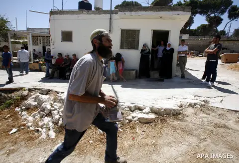 An Israeli Jewish settler work at a Palestinian house after Israeli police evict his owner in Ras al-Amoud neighborhood, south of al-Aqsa Mosque in Jerusalem's Old City, on 02 Septemper 2012. The Hamadallah's house is lo...