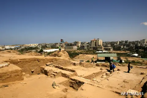 Palestinian workers do excavation in a new discovered archeological site dating back to the Iron-Age period in Rafah, southern Gaza Strip, on Aug. 30, 2012. Photo by Eyad Al Baba