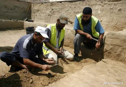 Palestinian workers do excavation in a new discovered archeological site dating back to the Iron-Age period in Rafah, southern Gaza Strip, on Aug. 30, 2012. Photo by Eyad Al Baba