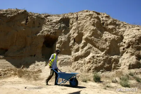 Palestinian workers do excavation in a new discovered archeological site dating back to the Iron-Age period in Rafah, southern Gaza Strip, on Aug. 30, 2012. Photo by Eyad Al Baba