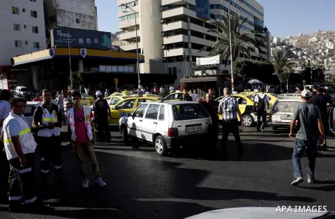 Palestinian taxi drivers park their cars during a protest against rising fuel prices and the high cost of living, in the West Bank city of Nablus, Wednesday Sept. 6, 2012. Photo by Nedal Eshtayah