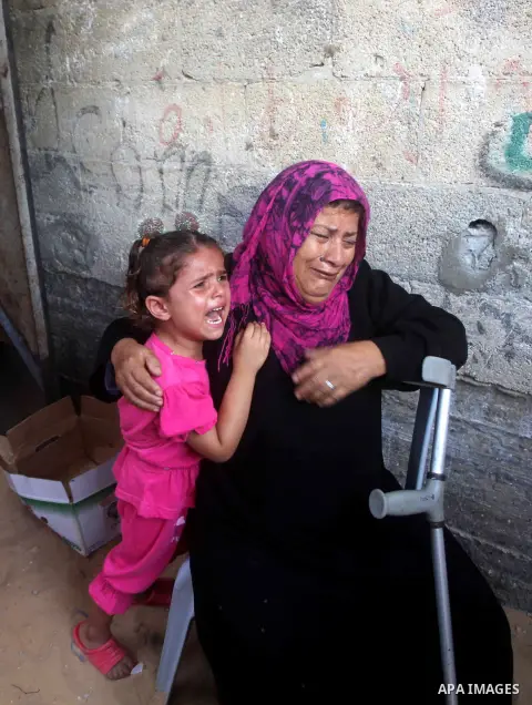 Relatives of Palestinian Tareq al-Kafarna mourn during his funeral in Beit Hanun in the northern Gaza Strip on September 6, 2012. Three Palestinians were killed by Israeli fire in the northern Gaza Strip, raising to six...