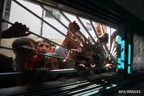 Palestinian relatives of Ihab and Akram al-Zaanin, two brothers who were killed by Israeli fire in the northern Gaza Strip, mourn their death on September 6, 2012. Three Palestinians were killed by Israeli fire in the no...